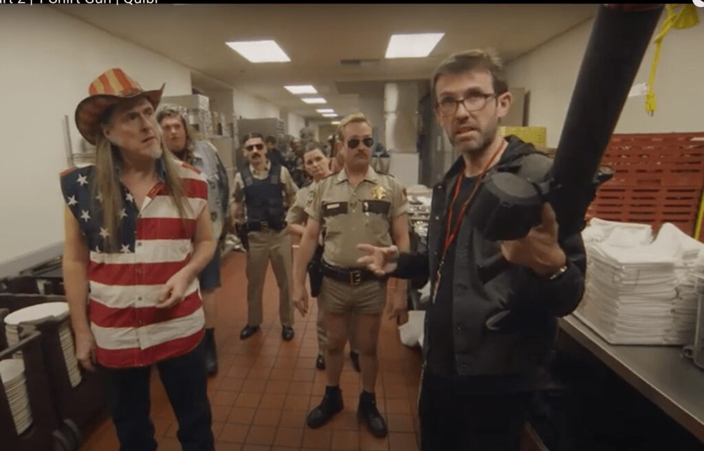 Watch 'Weird Al' Yankovic's Ted Nugent Fire Up the Crowd in <i>Reno 911!</i> Clip