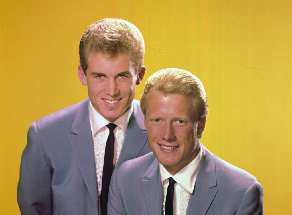 Photo of Jan & Dean rock duo with a yellow background