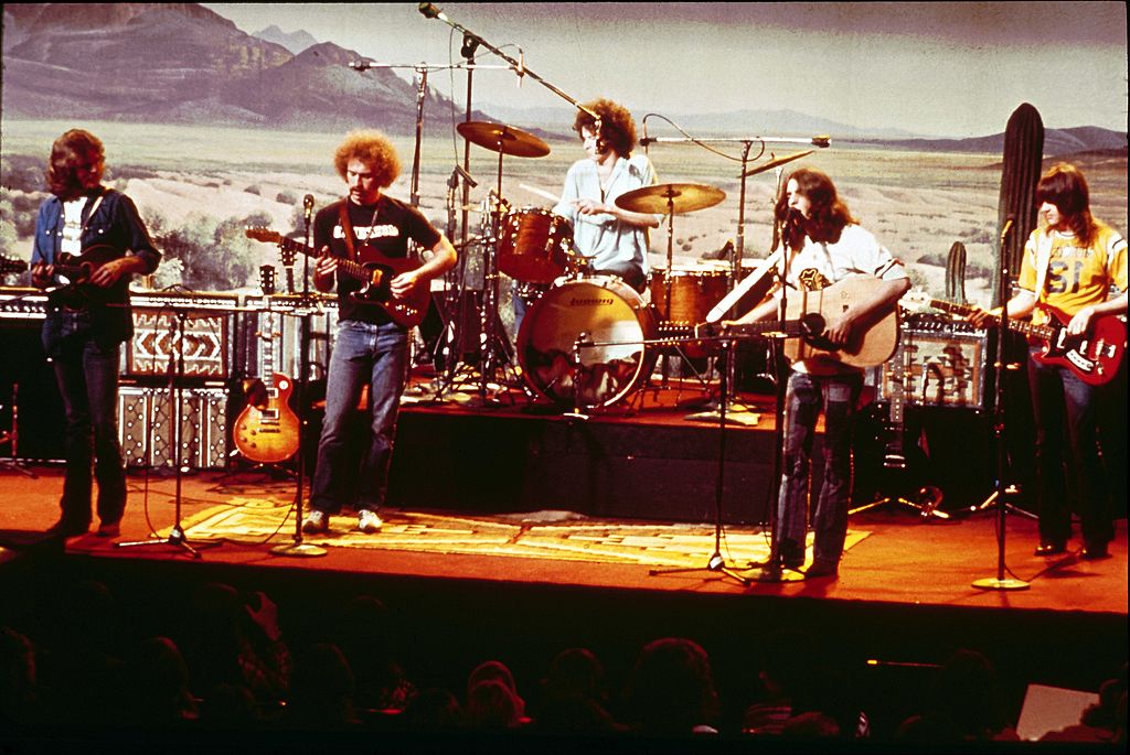 Band playing onstage in 1975