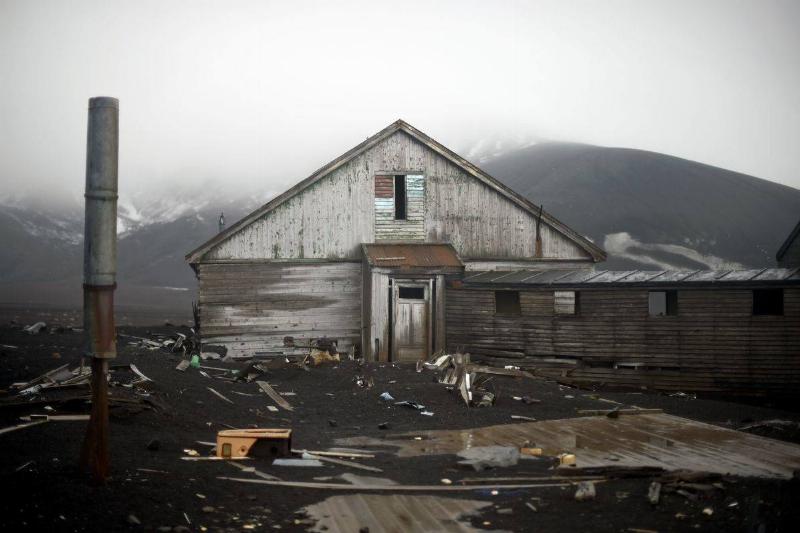 An old building of a British shipping base, which was consumed by a mudslide sparked by a volcano, crumbles at Whalers Bay in Deception Island