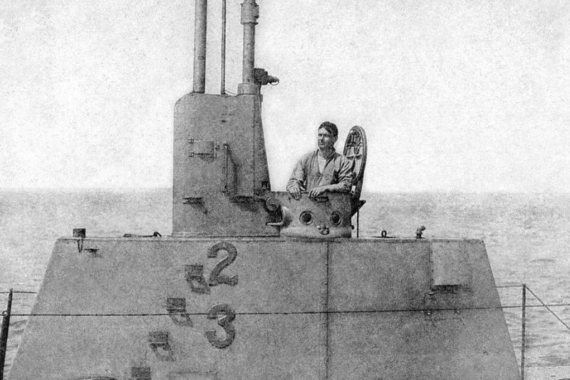 Man on top of a submarine