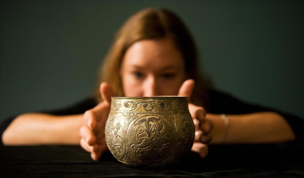 A gilt silver vessel from the Vale of York viking hoard is displayed at a press conference to unveil the newly conserved hoard at the British Museum