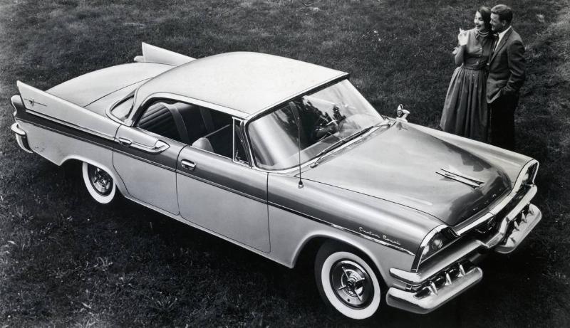 1957 Dodge Lancer 4-Door with Couple Standing