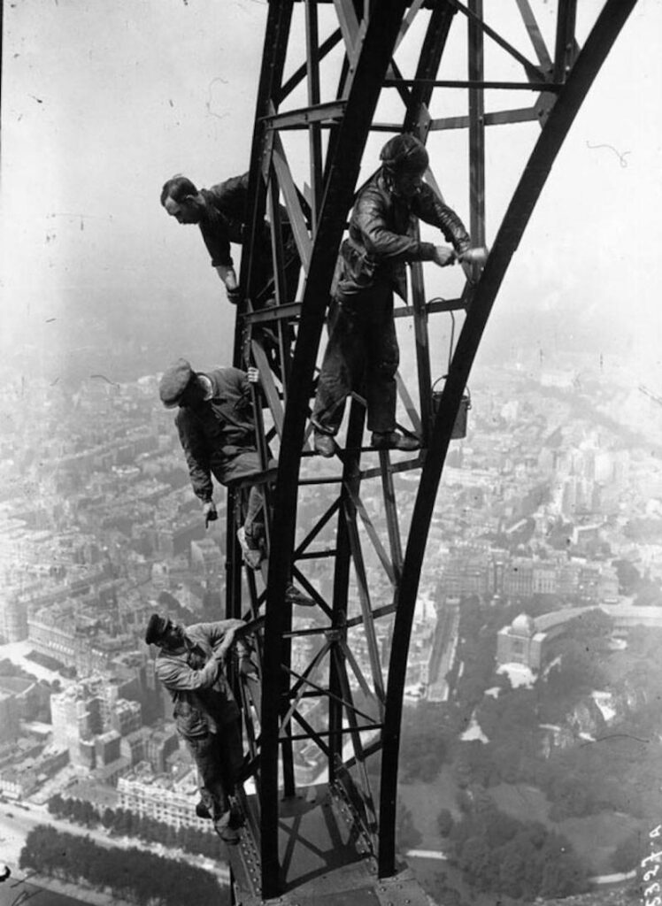 men painting eiffel tower 1932