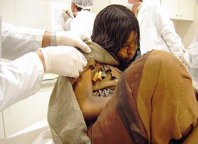 Researchers examine a 500-year-old preserved girl named Juanita.