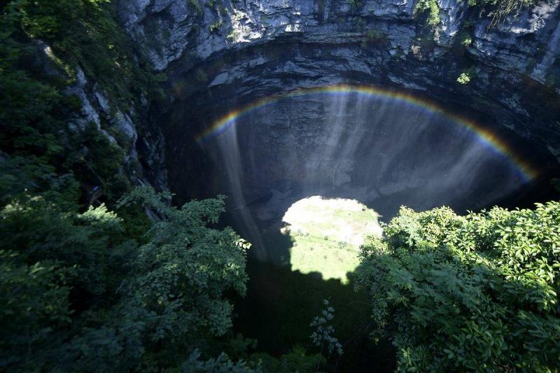 Rainbow Appears At Karst Sinkhole In Xuan'en County