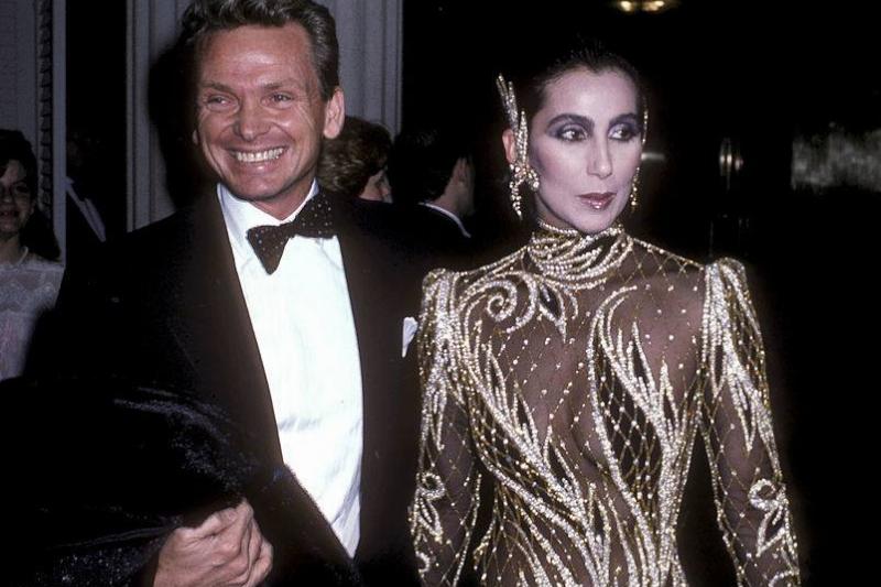 Cher attends an art show with fashion designer Bob Mackie.