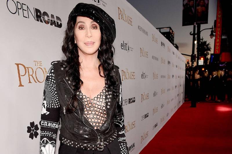 Cher attends a premiere at the Chinese Theatre.