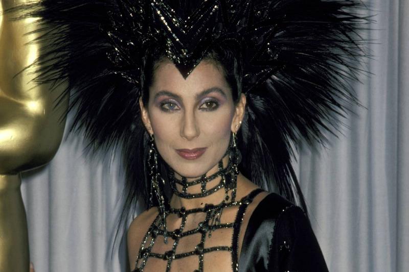 Cher wears a poofy, black wig to an event.