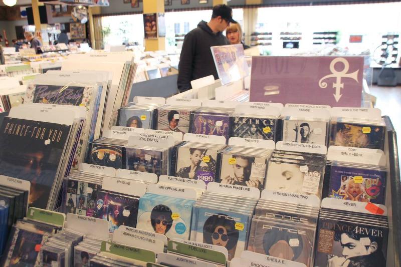 Albums by the musician Prince are on display at a record store.