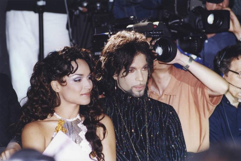 Prince and Mayte Garcia get interviewed by paparazzi.