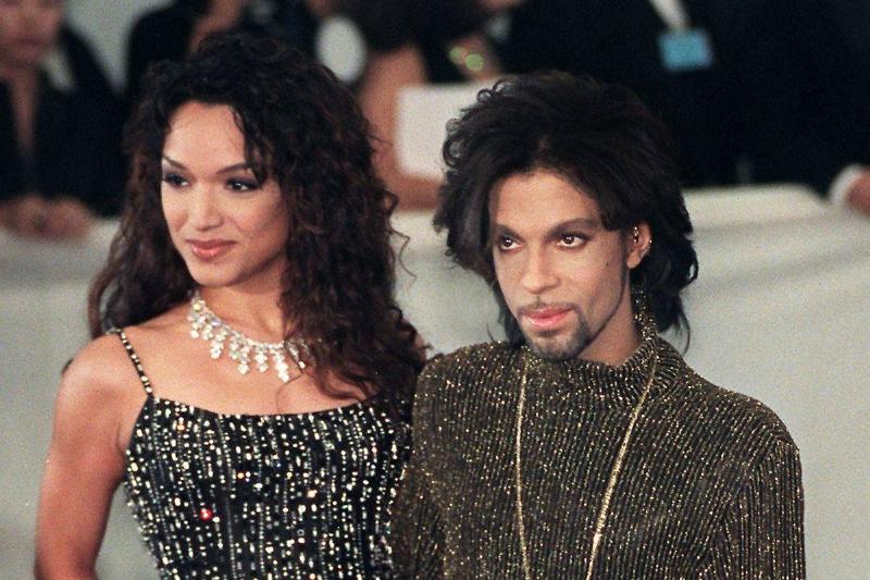 Prince poses for photographers with his wife Mayte in 1999.