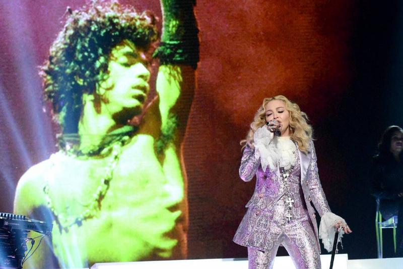 Recording artist Madonna performs a tribute to Prince onstage.